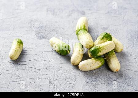 https://l450v.alamy.com/450v/2c5dp1a/baby-cucumbers-with-unusual-coloring-on-gray-background-2c5dp1a.jpg