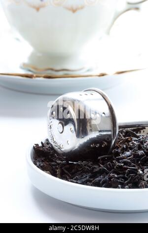Close up of tea infuser with loose tea Stock Photo