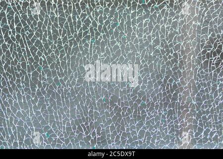 Broken tempered glass. Cracked glass web. Stock Photo