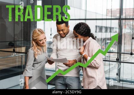 smiling multicultural businesspeople looking at papers while standing in office, traders illustration Stock Photo