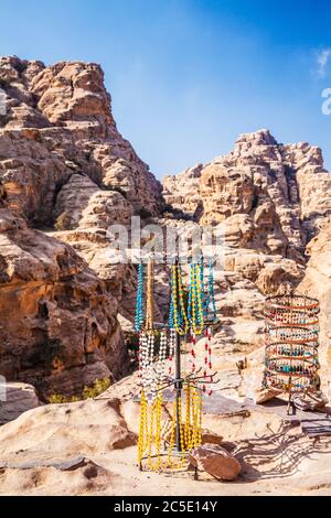 Tourist souvenirs on display in Siq Al-Barid or Little Petra in Jordan. Stock Photo