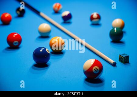 The game of American billiards. Multi-colored billiard balls on gaming table. Stock Photo