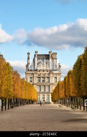 Fall color in Jardin des Tuileries with Pavillon de Flore of Musee du Louvre beyond, Paris, France Stock Photo