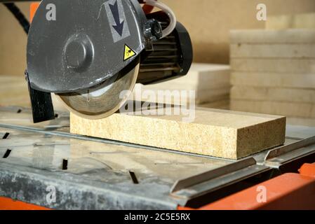 Circular saw with sawed-off tile. Equipment for the repair of apartments. Stock Photo