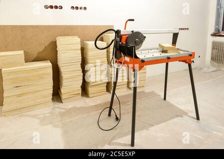 The machine with a circular saw in a repaired house Stock Photo