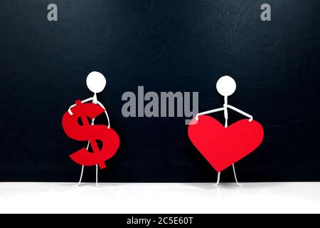 Human stick figures holding a red heart shape and a dollar sign. Money versus love, family or career, and health over economy concept. Stock Photo