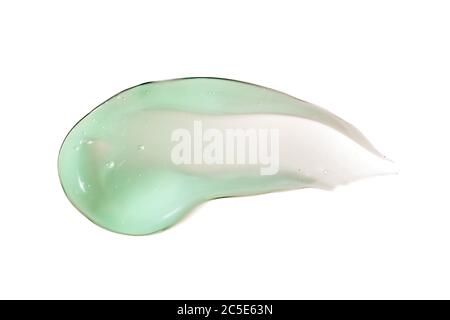 Green smear of cosmetic cream isolated on white background. Creamy foundation texture. Body care, beauty concept.