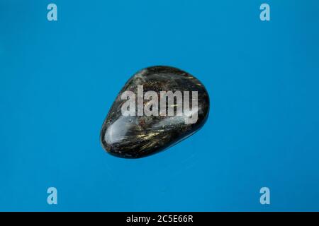 Astrophyllite is a very rare, brown to golden-yellow hydrous potassium iron titanium silicate mineral. Stock Photo