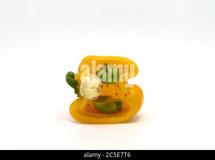 Sweet pepper yellow in cross-section on a light background. Natural product. Natural color. Close-up. Stock Photo