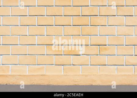 Yellow wall made from concrete of the building exterior. Stock Photo
