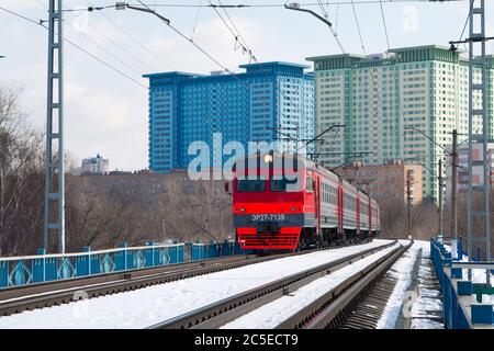 A local train on snow covered tracks in Moscow Stock Photo