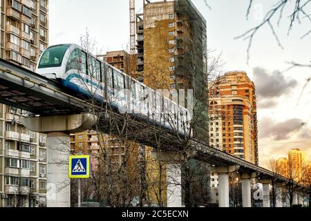A monorail train runs above the street in Moscow, Russia Stock Photo