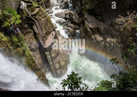 A wonderful rainbow in the canyon of the waterfalls called 'pailon del diablo' near Baños de Agua Santa Stock Photo