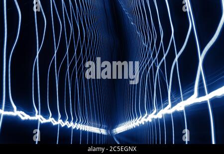 Light trails pattern in metro tunnel, long exposure of movement. Blue light lines for abstract background. Fast motion with visual light wave effect. Stock Photo