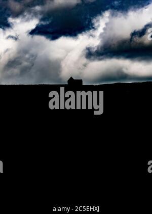 Silhouette of the derelict Buckstones House on the A640 Huddersfield. Stock Photo