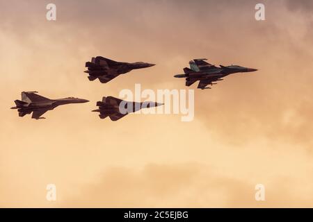 Moscow Region - July 21, 2017: Modern Russian strike fighters Sukhoi Su-35, Su-34 and two newest Su-57 (T-50 PAK FA) at the International Aviation and Stock Photo