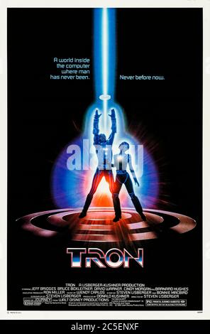 Tron (1982) directed by Steven Lisberger and starring Jeff Bridges, Bruce Boxleitner, David Warner and Cindy Morgan. A computer hacker and programmer is transported inside the software of a computer and joins forces with Tron to stop the Master Control Program seizing control of the digital world. Stock Photo