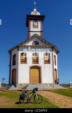 Old church of Santa Rita, from the beginning of the 18th century, with a clock in its tower, Historic city of Serro, State of Minas Gerais, Brazil Stock Photo