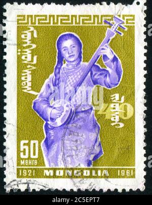 MONGOLIA - CIRCA 1961: stamp printed by Mongolia, shows musician, circa 1961. Stock Photo