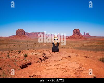 Young blonde girl admires panorama from Artist's Point in Oljato Monument Valley Stock Photo