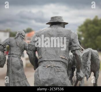 Ponte de Lima, Portugal - May 13, 2020:  Bronze statue representing the hard work of Minho farmers' families in the past, using oxen to farm the land. Stock Photo