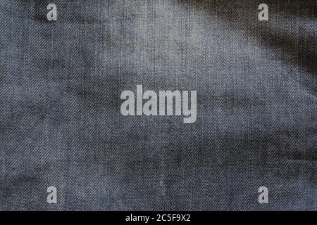 Jeans pattern. View to abstract space of empty dark blue natural clean denim texture for the business background. Stock Photo