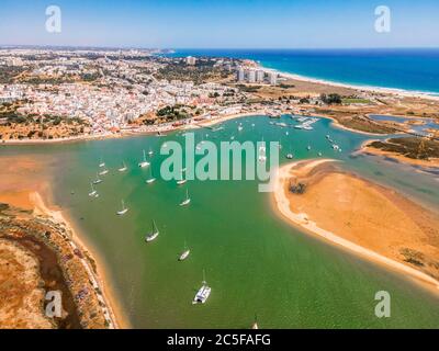 Aerial view, bay with yachts and view of coastal town Alvor, Algarve, Portugal Stock Photo