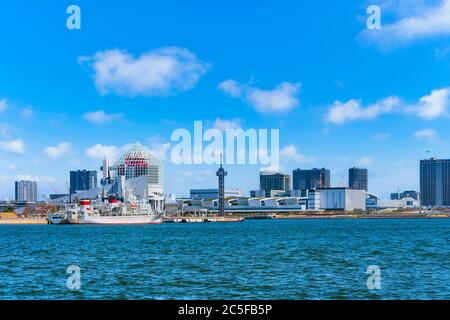 tokyo, japan - april 04 2020: Seascape of ship moored at Harumi Passenger Terminal and Harumi Wharf on Tokyo Bay in front of the new Toyosu Wholesale Stock Photo