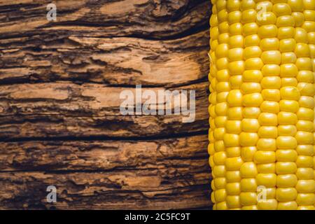 Corn isolated on wooden background Stock Photo