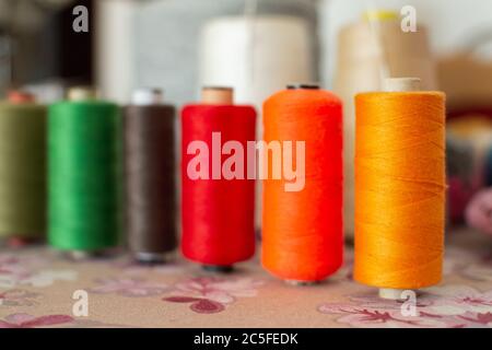 Cotrast colors threads on table Stock Photo