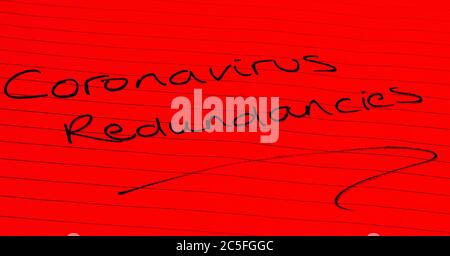 ‘Coronavirus redundancies’ written on lined paper Stock Photo