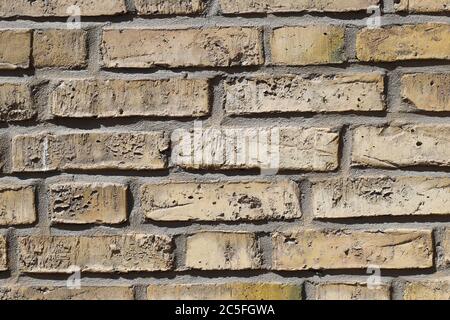Close-up of a yellow old brick wall Stock Photo