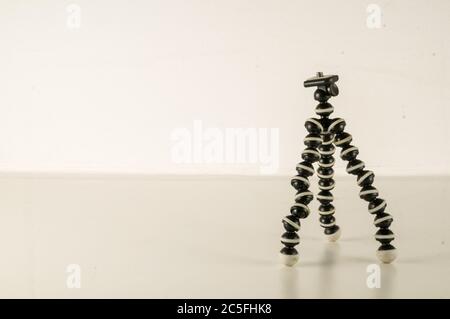 Mini table flexible tripod on white background Stock Photo