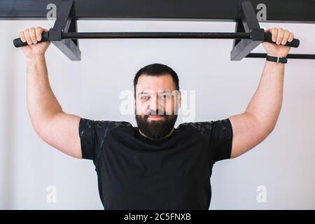 man training at the gym isolated on white background Stock Photo