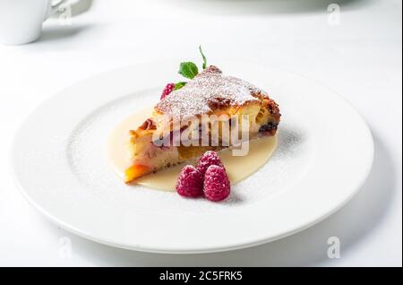 Piece of delicious clafoutis with nectarine and plum Stock Photo