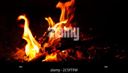 Coal burning fires that sparkle again with the wind again and start burning in super slow motion capture. Stock Photo