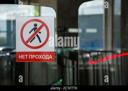 No entry sign and inscription in russian on glass doors of metro turnstile Stock Photo