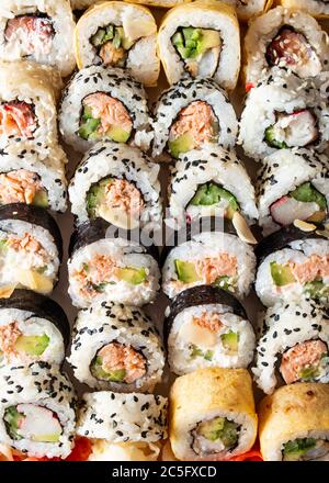 Japanese seafood sushi set isolate on black background with ice. Stock Photo