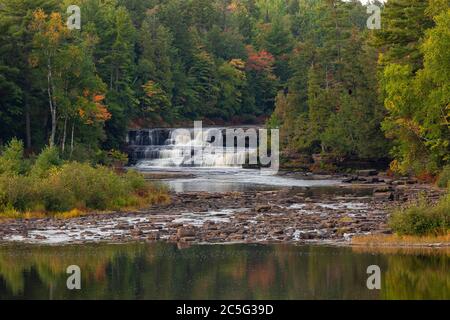 Tahquamenon Falls State Park  MI / SEPT  Soft morning light on lower Tahquamenon Falls beyond a stream rock garden. Stock Photo