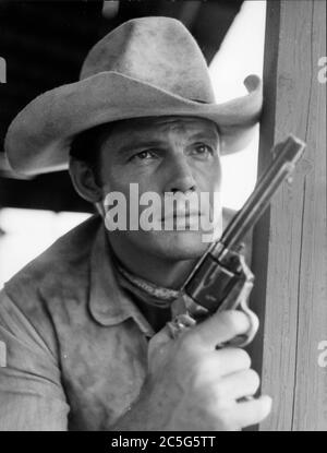 June 1, 1962 - Rome, Italy - Actor ADAM WEST stars in his first Italian film, 'The Relentless Four' directed by P. Zeglio. West, wearing a cowboy hat, bandanna and holding a gun, performs in a scene from the film.   (Credit Image: © Keystone Press Agency/Keystone USA via ZUMAPRESS.com) Stock Photo