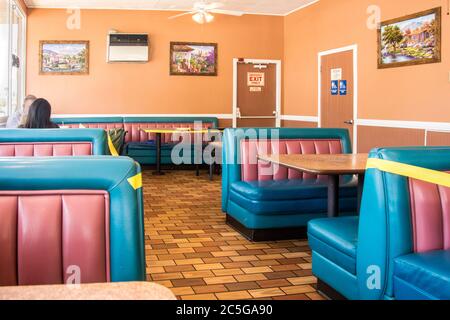 An area of a restaurant that has been closed off to maintain the appropriate social distance in response to the COVID19 virus. Stock Photo