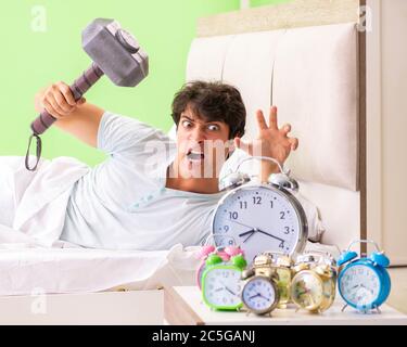 The young man having trouble waking up in early morning Stock Photo