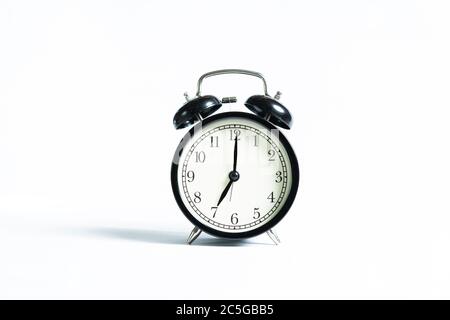 A black alarm clock isolated against white background Stock Photo