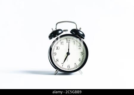 A black alarm clock isolated against white background Stock Photo