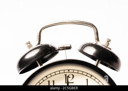 A black alarm clock isolated against white background Stock Photo