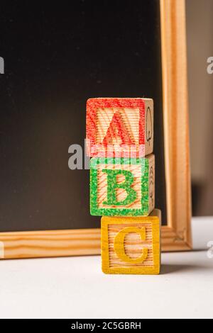 ABC blocks arranged in stack, education and kids background Stock Photo