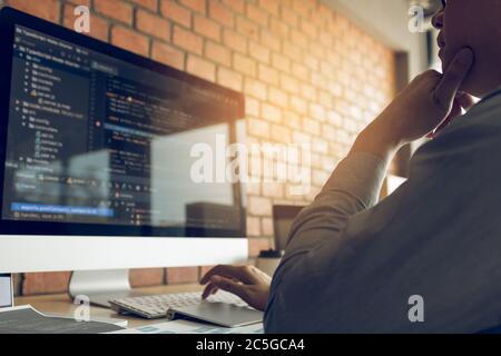 Developing programming and coding technology working in a software develop company office. Stock Photo