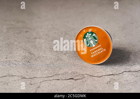 Illustrative editorial shot of Starbucks Caramel Macchiato coffee capsules Stock Photo