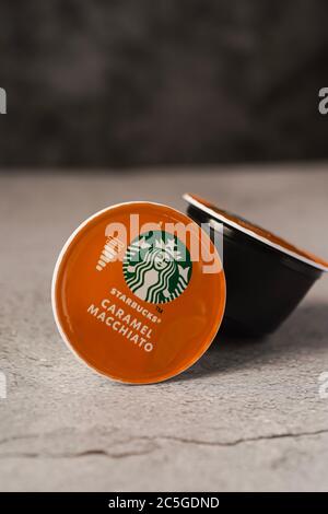Illustrative editorial shot of Starbucks Caramel Macchiato coffee capsules Stock Photo