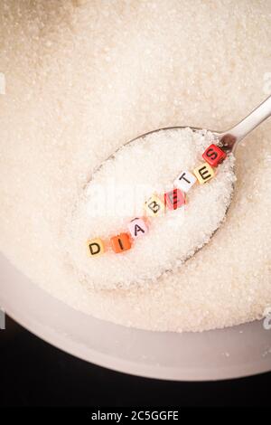 Diabetes Concept: Diabetes wordings on top of sugar heaps. November is World Diabetes Month Stock Photo